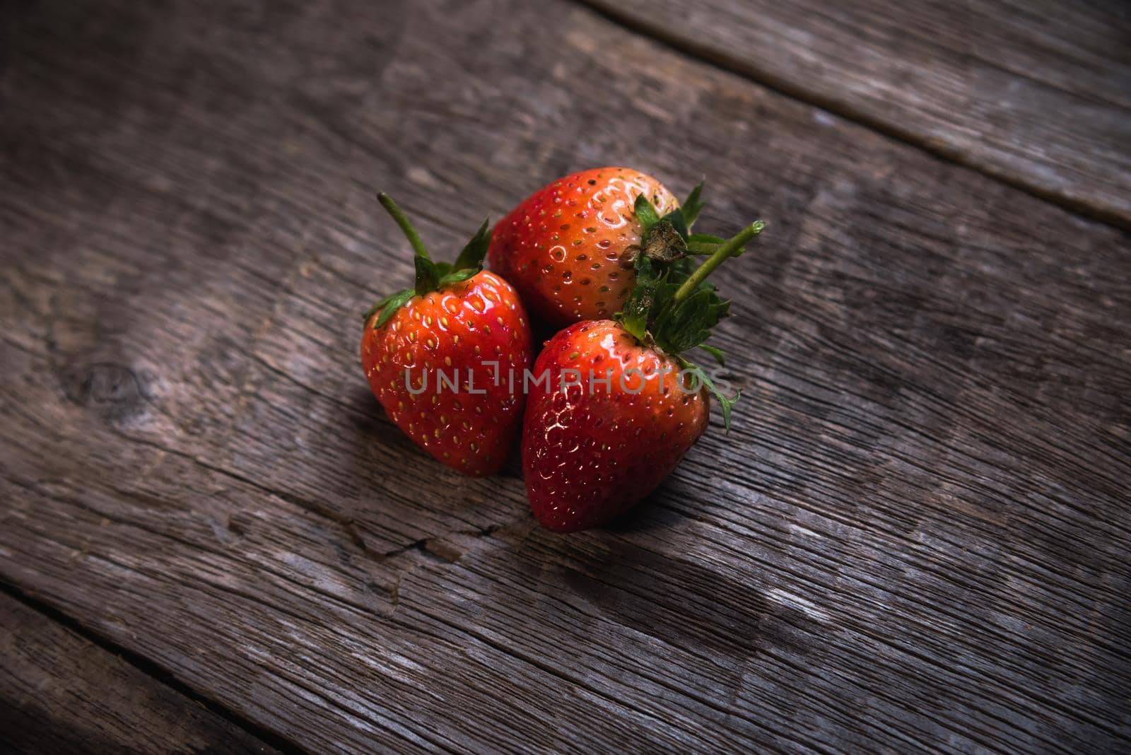 Fresh strawberry on wooden background. Top view, flat lay