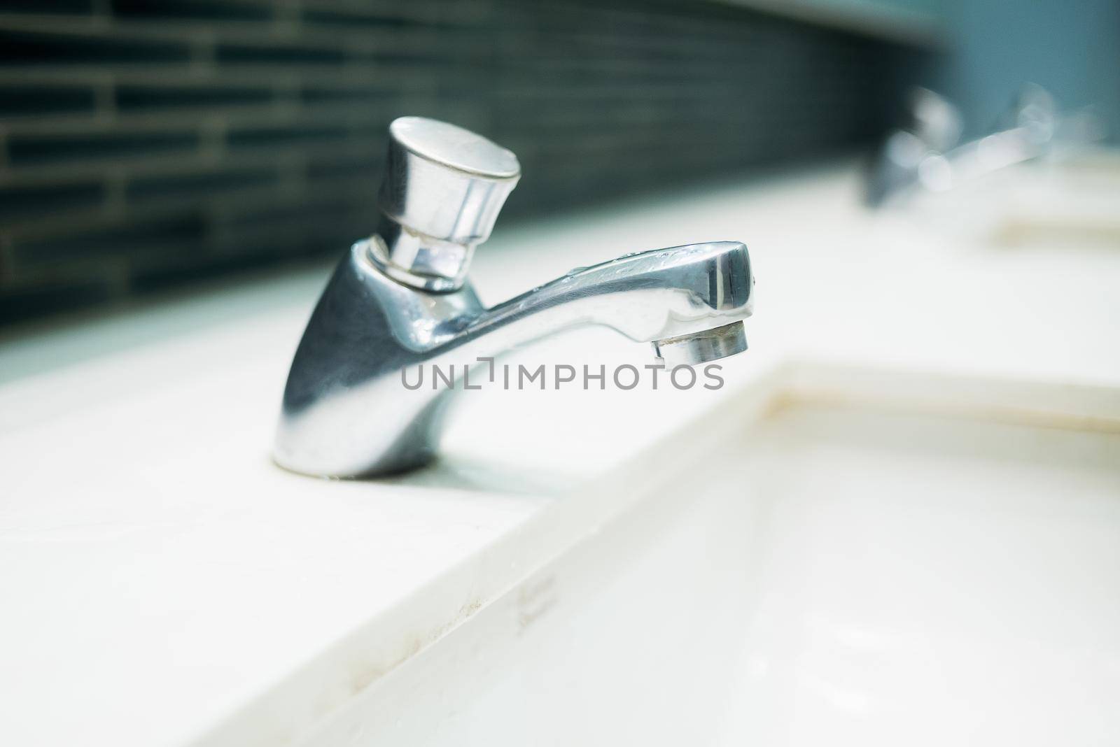 Luxury faucet on a white sink in the bathroom