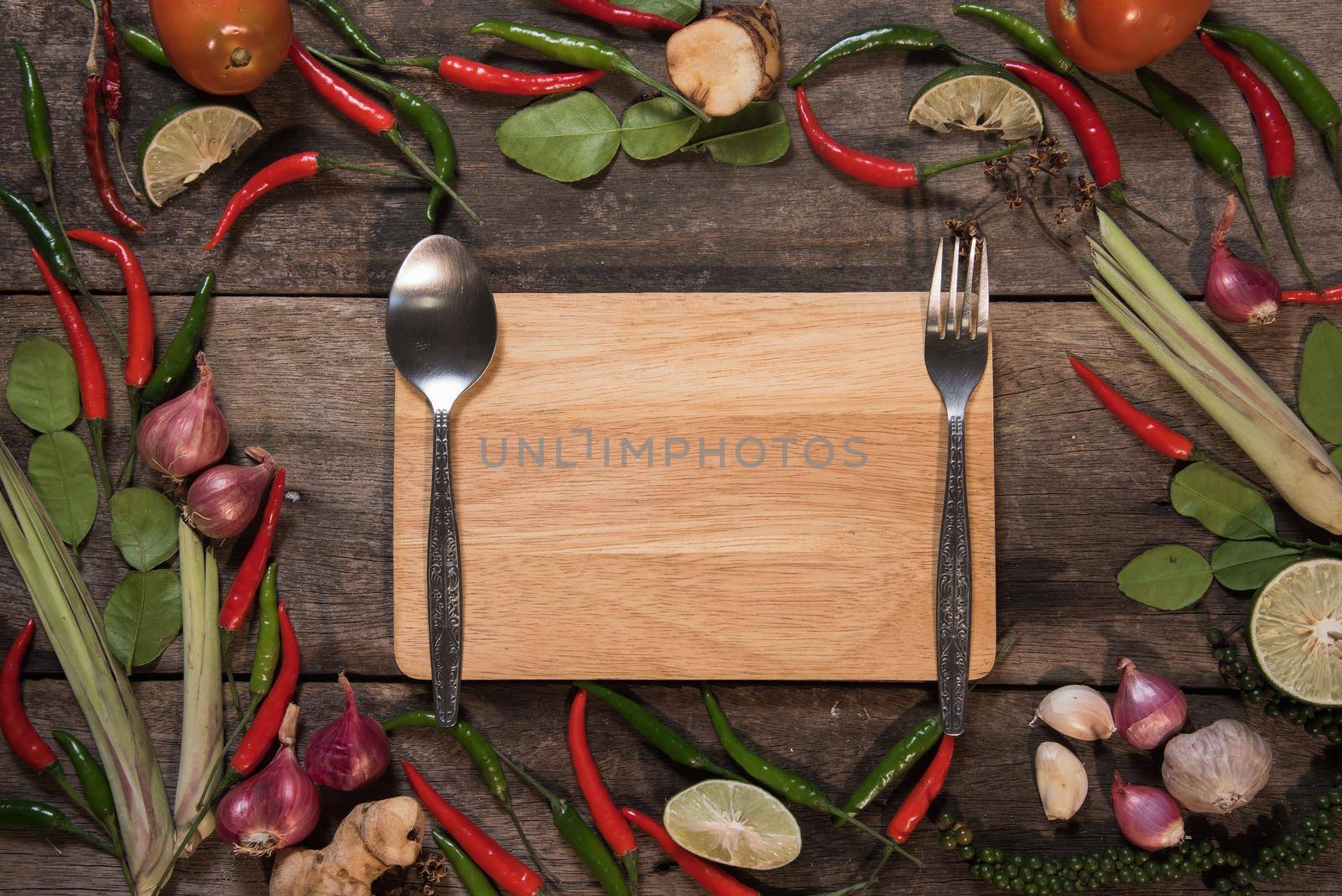 spices with ingredients on wood background. asian food, healthy or cooking concept.