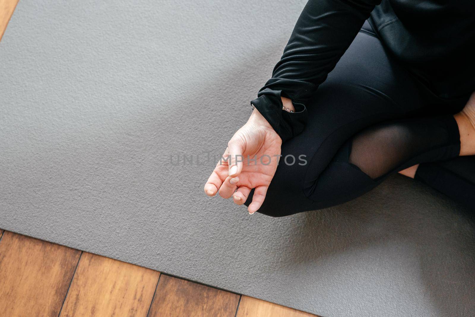 Close up of yoga woman sitting in lotus asana