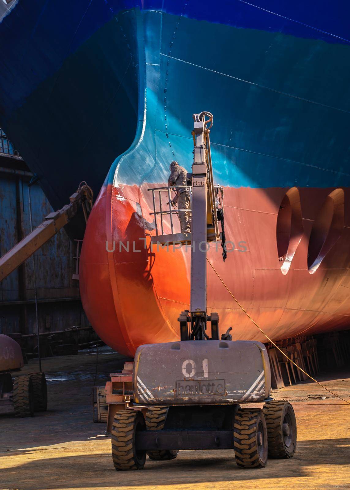 Chernomorsk, Ukraine. 21.03.2021. Painting the bottom of the ship at the dry dock of the Chernomorsk Shipyard