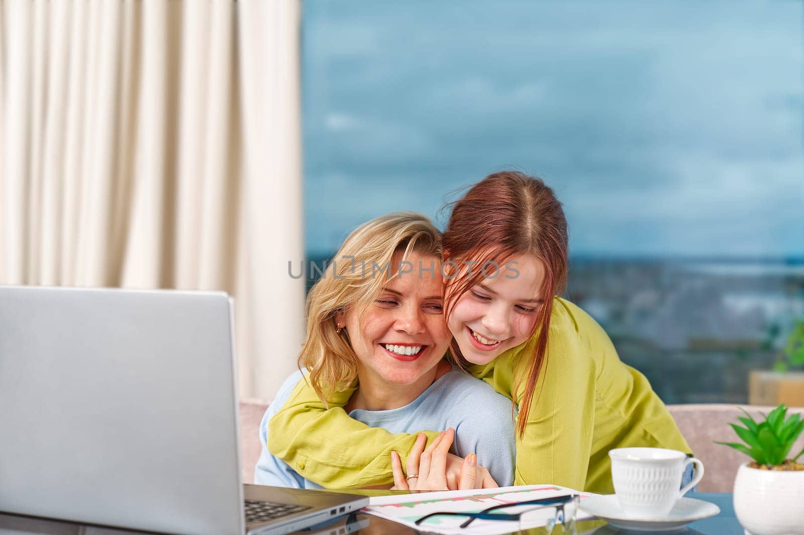 Mother with daughter working from home. Businesswoman mother woman with daughter trying to working by PhotoTime