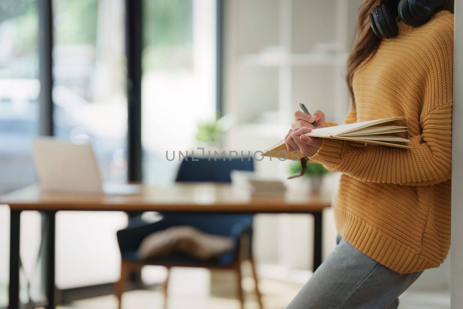 Beautiful young Asian woman college student at classroom. College student working on the college campus. back to school concept.