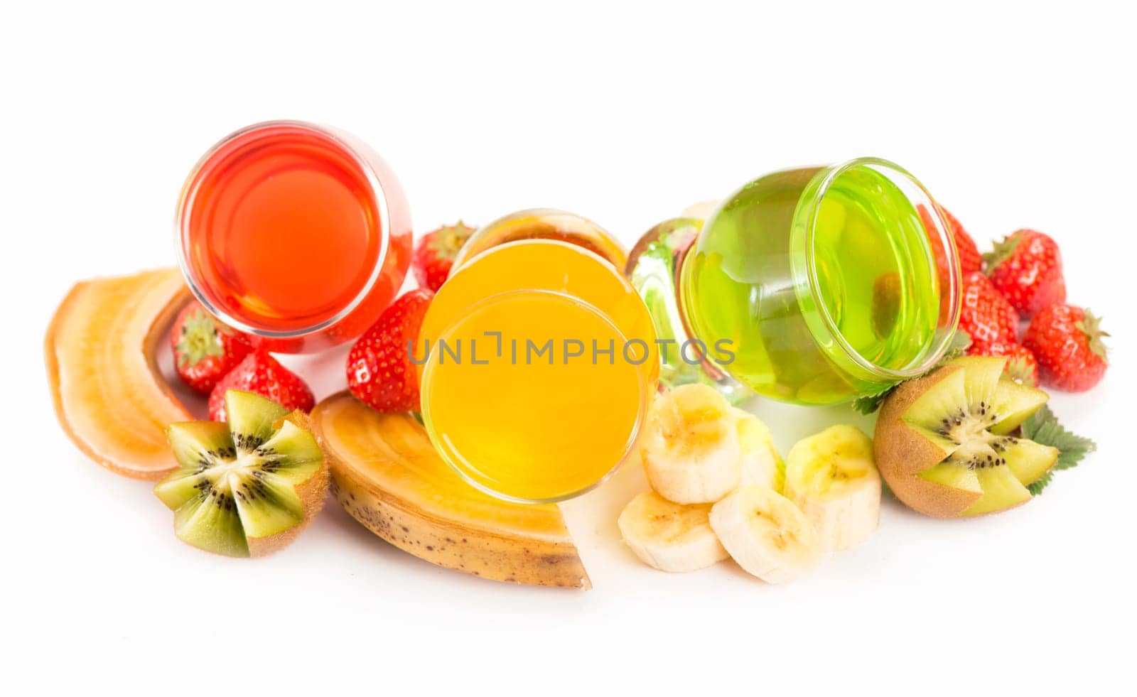 jelly with banana, kiwi and strawberry on a white background by aprilphoto