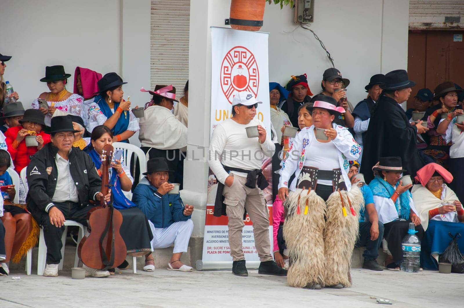 Otavalo, Ecuador - 24 de junio de 2023: indigenous community of ecuador resting after a performance of the inti raymi. High quality photo