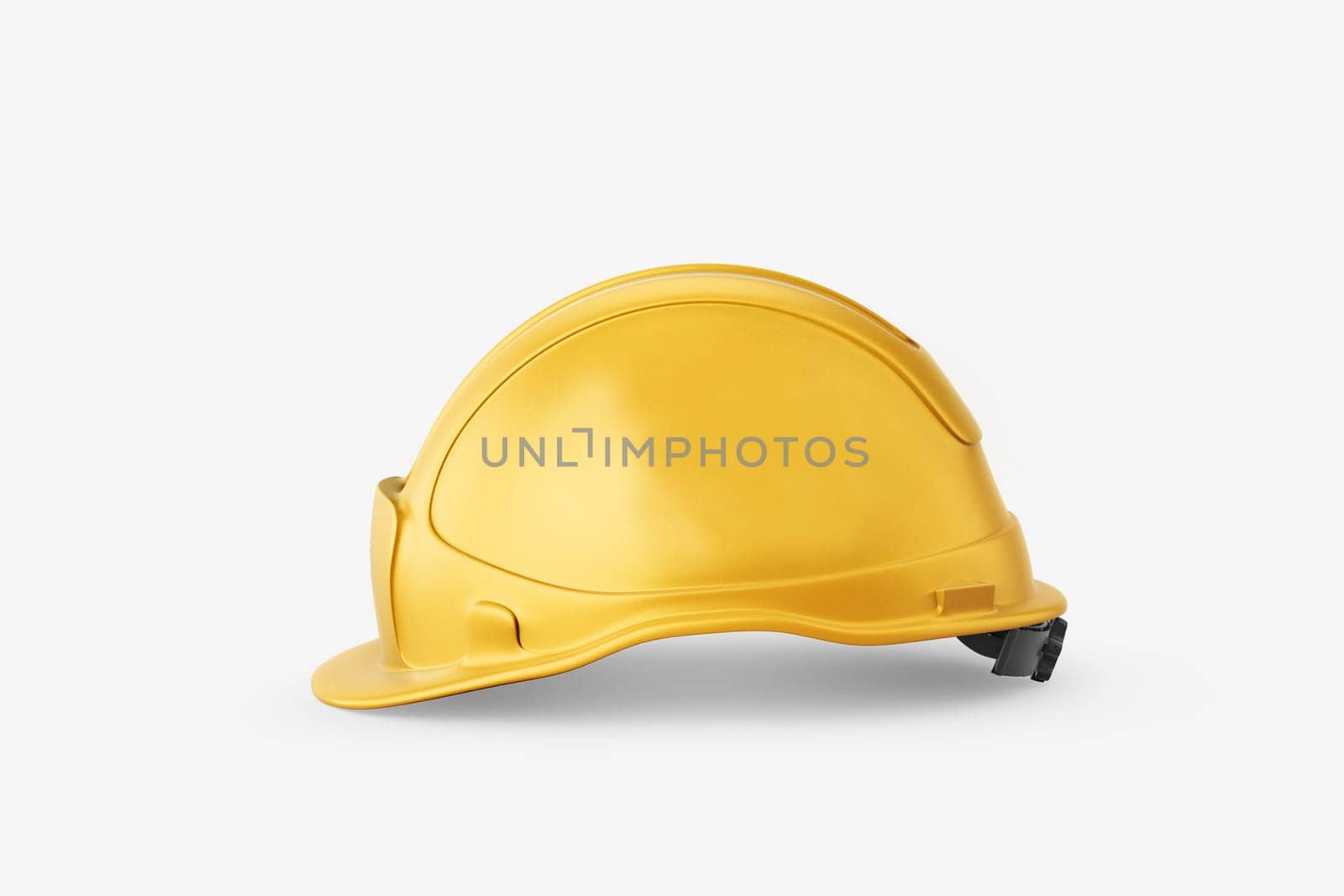 Yellow plastic construction protective helmet on a white background