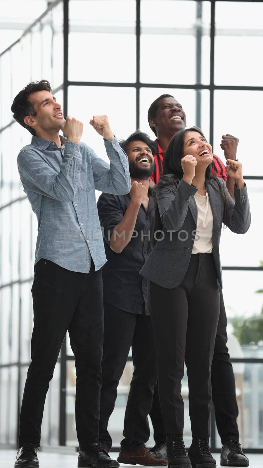 successful business team communicate in office corridor