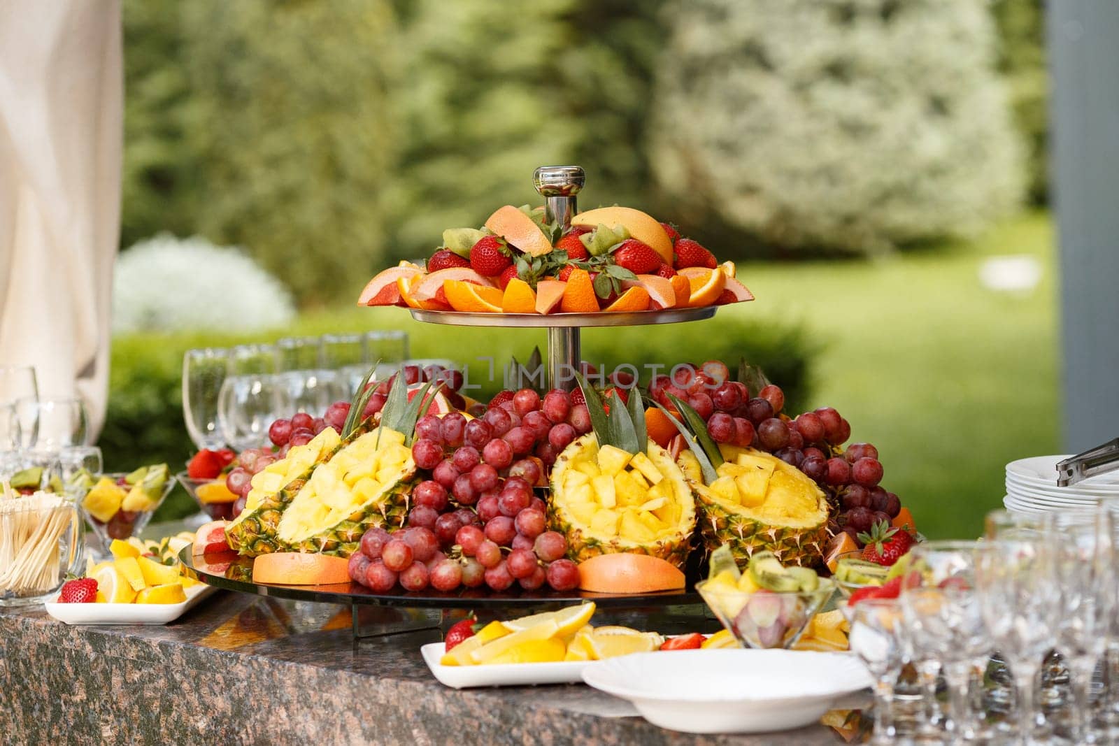 Mixed fruit arrangement on multiple tiers of trays