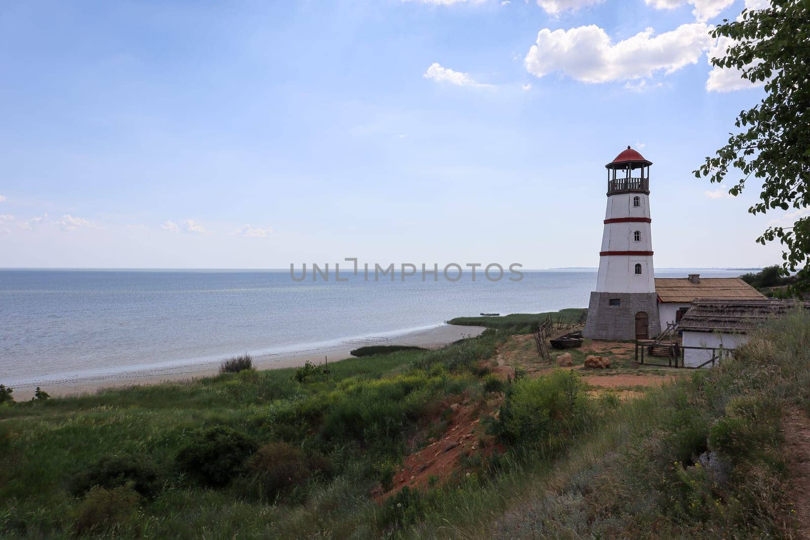 the old lighthouse against the blue sky. photo