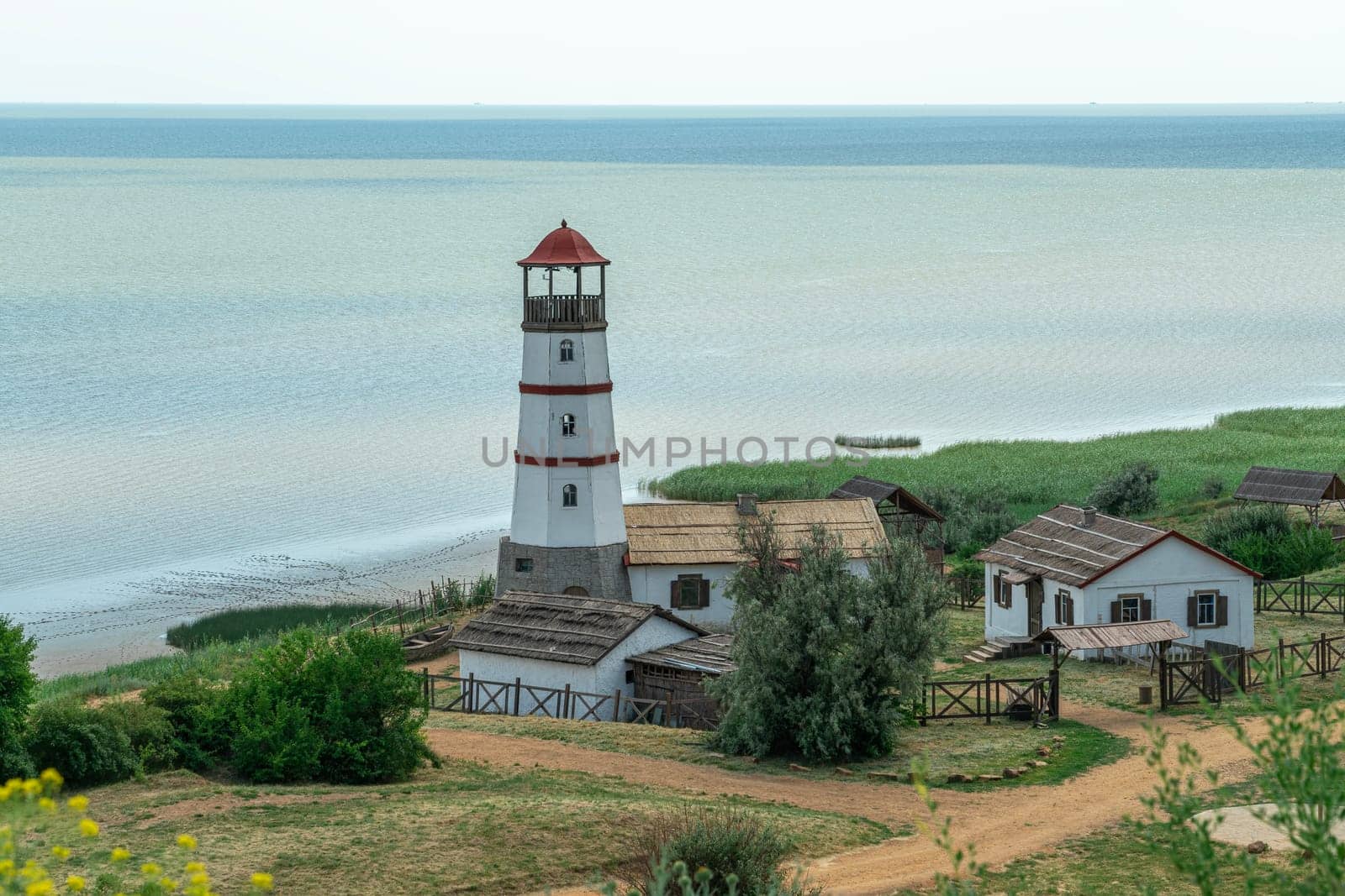 the old lighthouse against the blue sky. photo