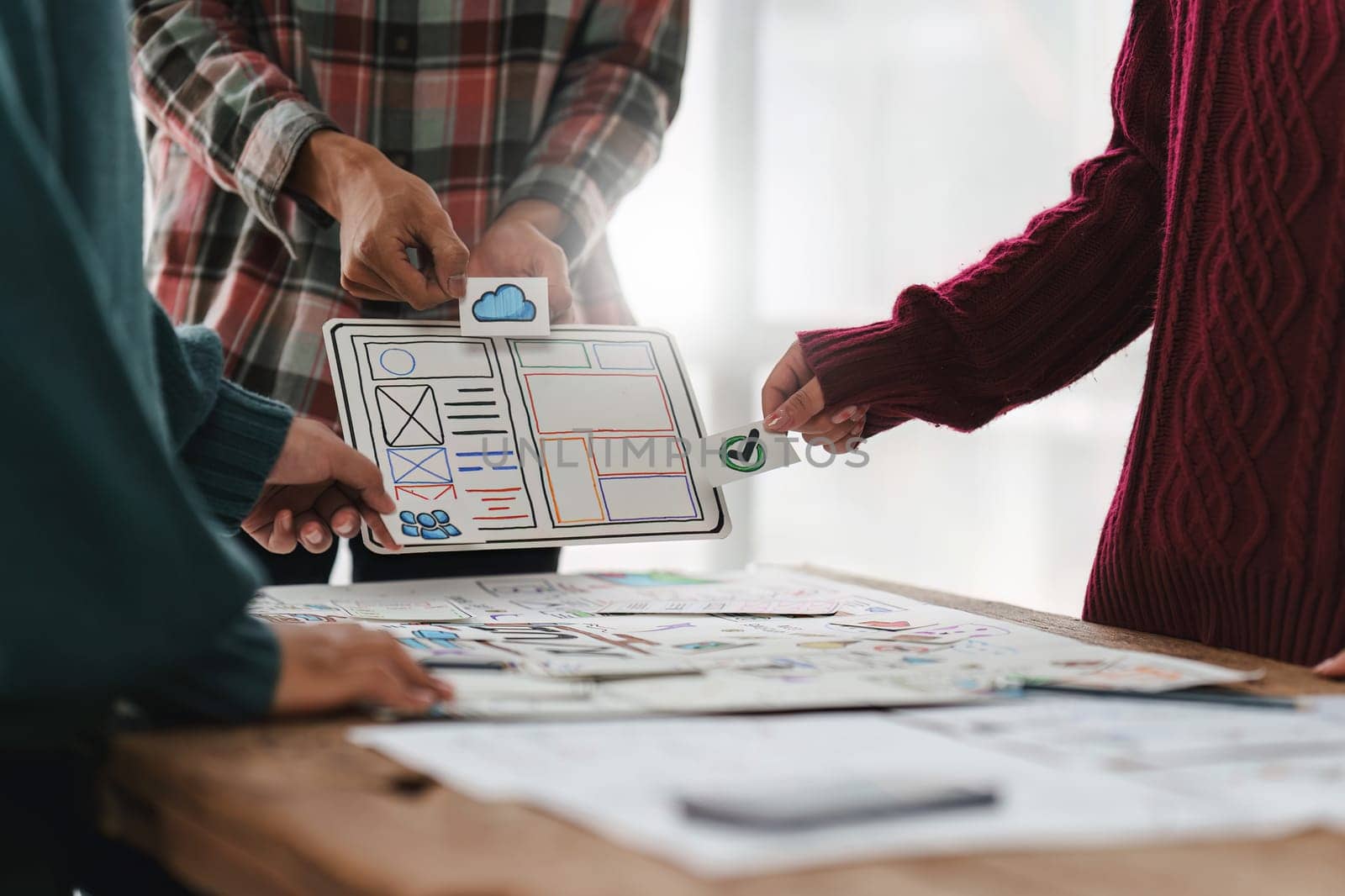 Close up ux developer and ui designer brainstorming interface wireframe design.Creative digital development agency.