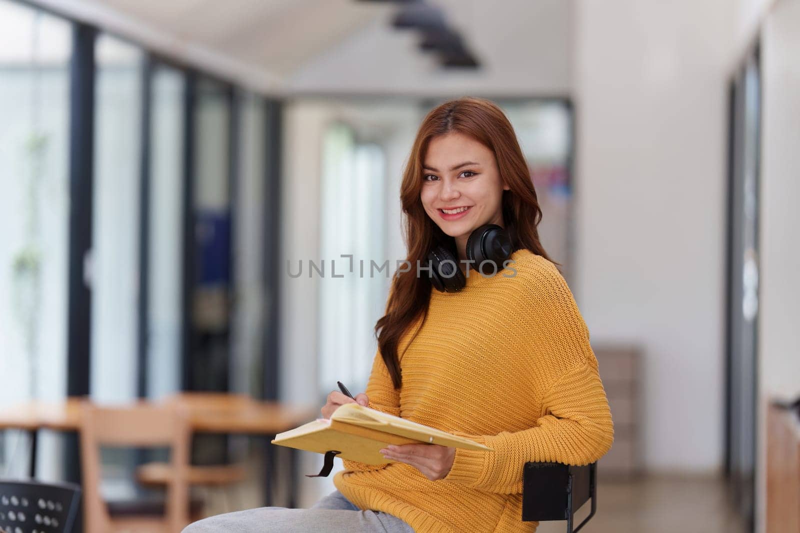Beautiful young Asian woman college student at classroom. College student working on the college campus. back to school concept.