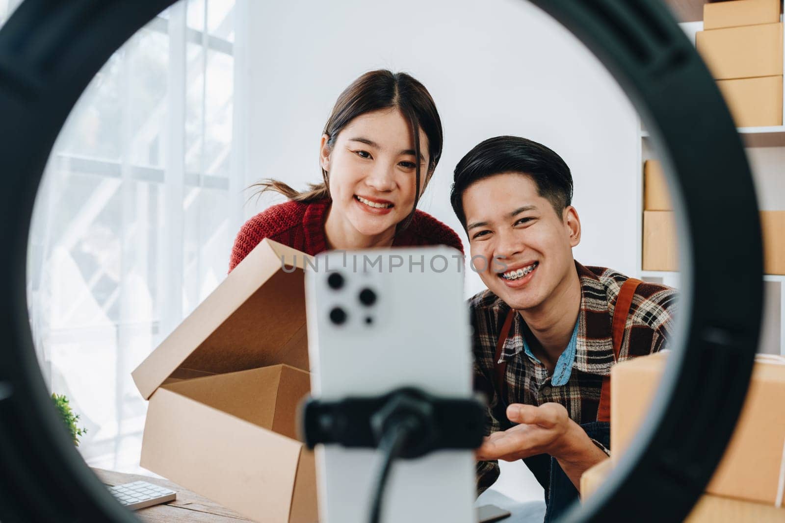 family business Asian people, vlogger, blog, presenting online products, live video, social media, record her, sell online via digital cameras by Manastrong