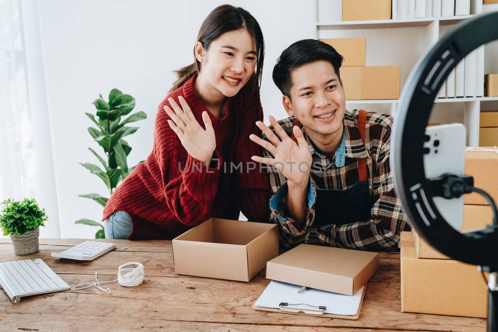 family business Asian people, vlogger, blog, presenting online products, live video, social media, record her, sell online via digital cameras by Manastrong