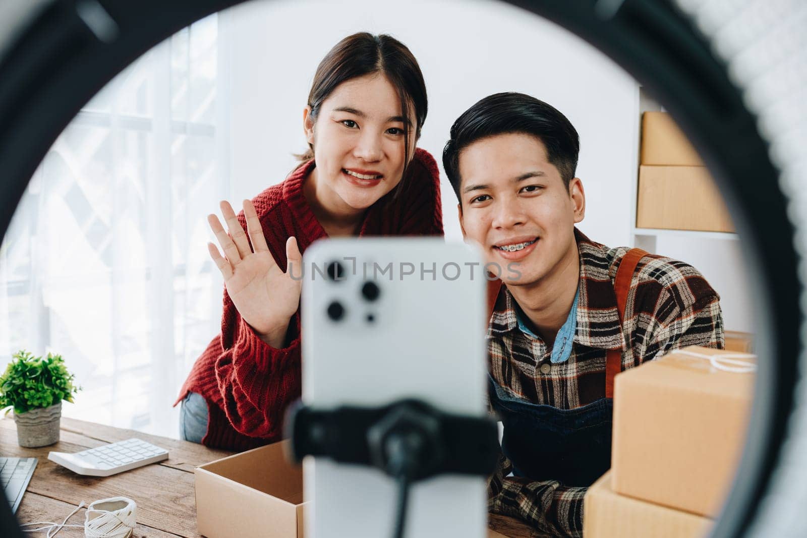 family business Asian people, vlogger, blog, presenting online products, live video, social media, record her, sell online via digital cameras by Manastrong