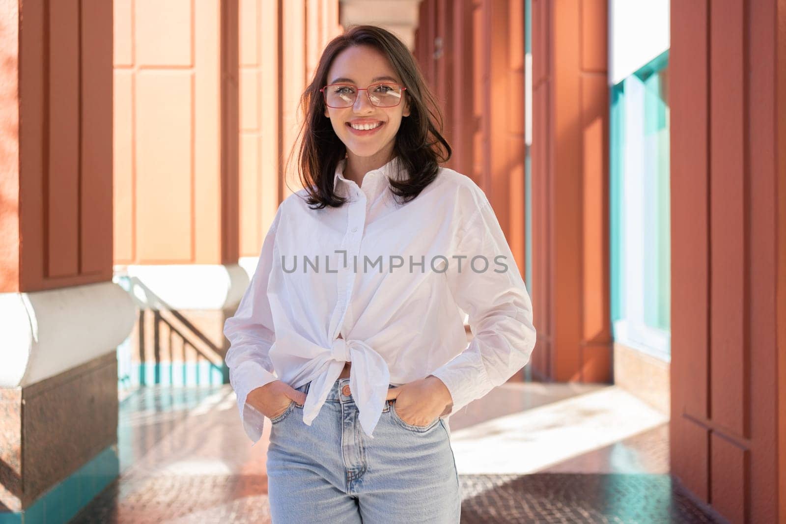 Successful smiling business woman wearing eyeglasses by andreonegin