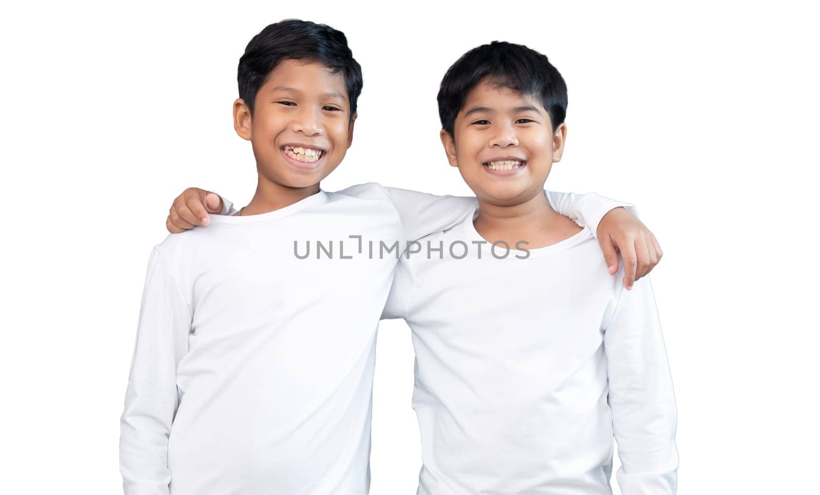 Brothers wearing white long-sleeved T-shirts smile and show joy together.