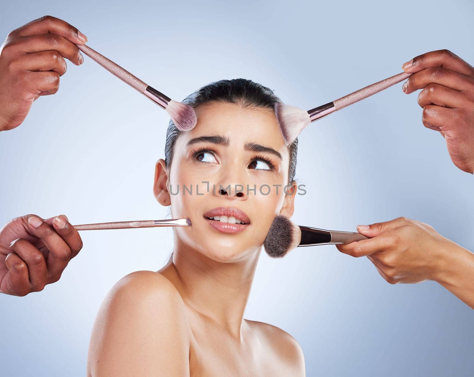 Brush, makeup and confused face of woman in studio for wellness, beauty and cosmetics on blue background. Cosmetology, skincare and girl with brushes for cosmetic application, foundation and products.