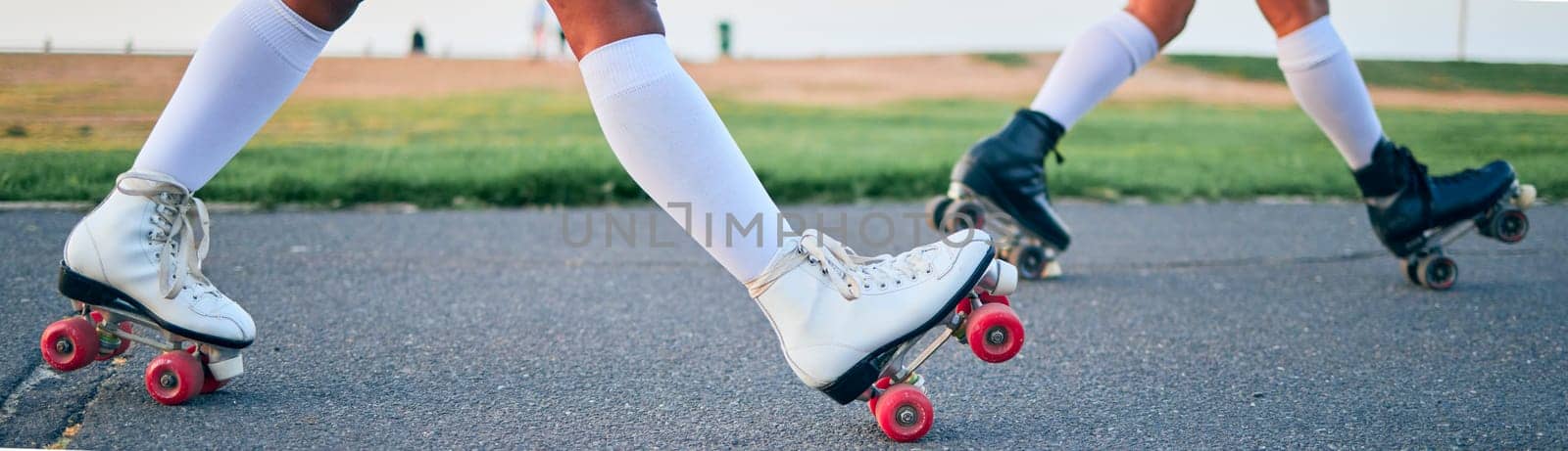 Legs, roller skates and shoes of friends on street for exercise, workout or training outdoor. Skating, feet of people and sports on road to travel, journey and moving for freedom, hobby and fitness by YuriArcurs