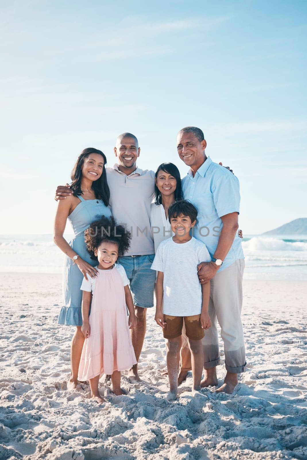 Beach, happy and portrait of a big family on a vacation, adventure or weekend trip for summer. Smile, bonding and children by the ocean with their parents and grandparents on tropical travel holiday