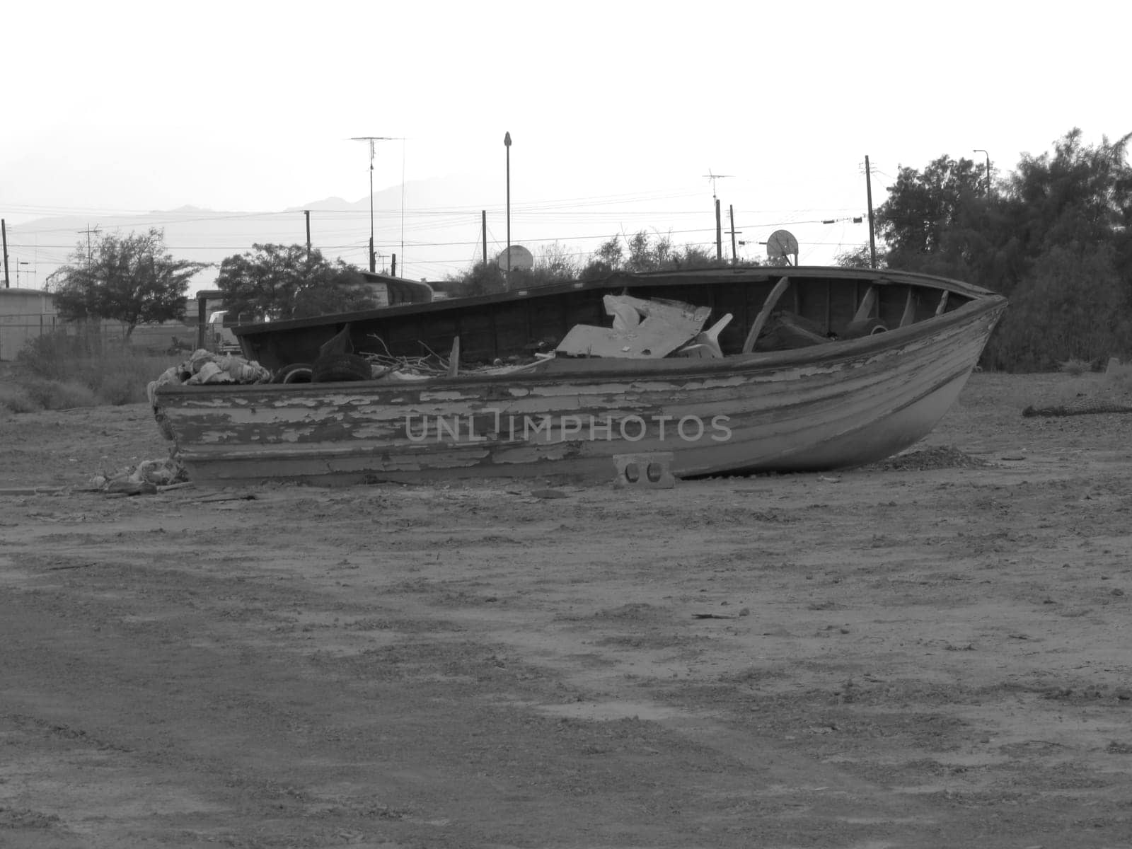 Black and White Abandoned Boat on Land in Bombay Beach, California by grumblytumbleweed