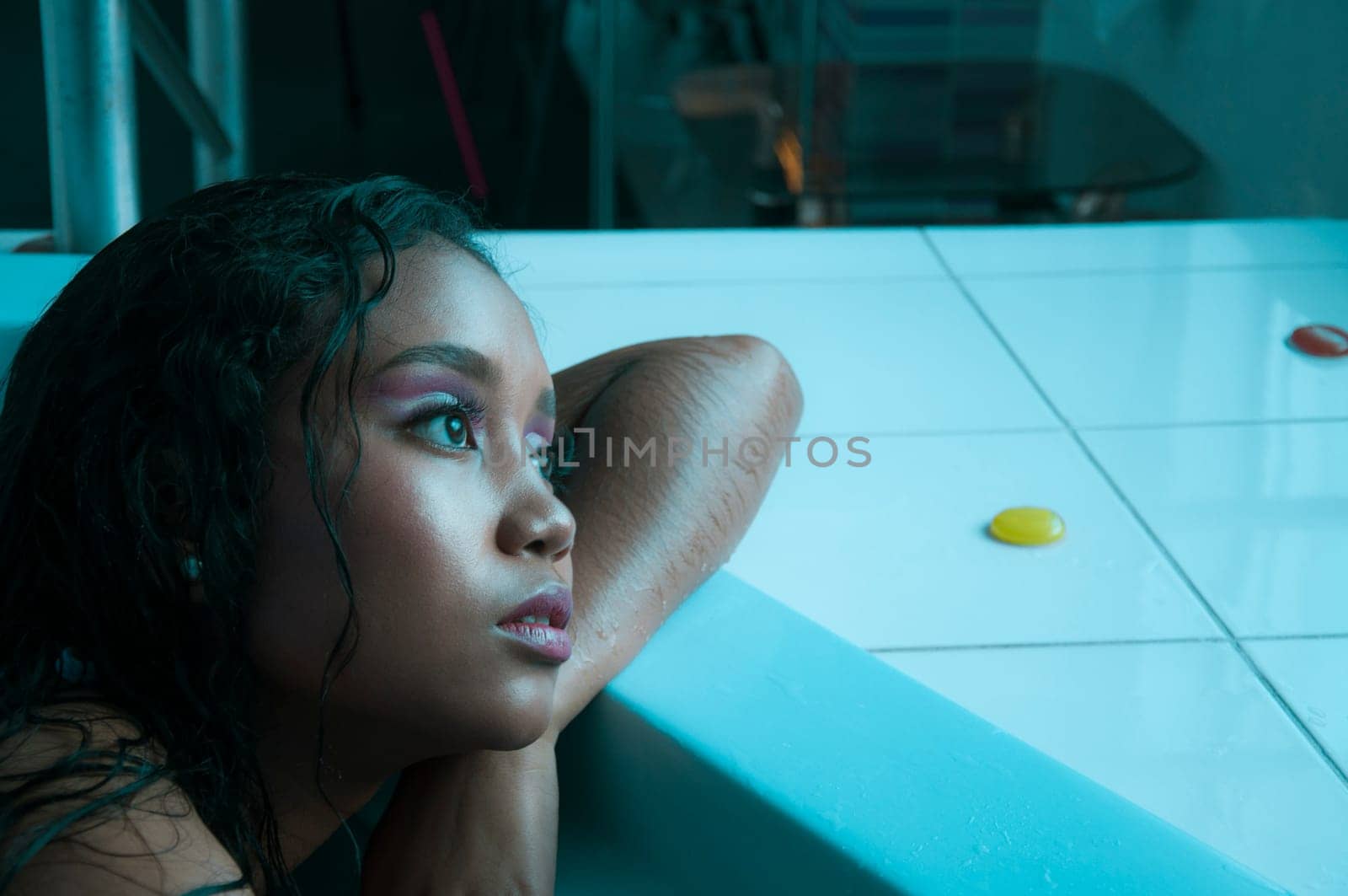 copyspace of a close up of a beautiful latin woman in a swimsuit inside a jacuzzi relaxing with hot water. High quality photo
