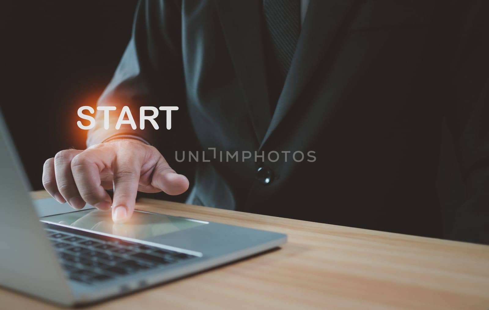Businessman pressing his finger to start a business. Startup concept. Business concept.
