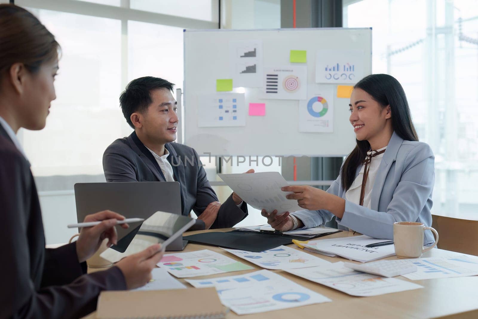 Business People Meeting to analysis the financial report paperwork in office. Financial advisor teamwork and accounting concept.