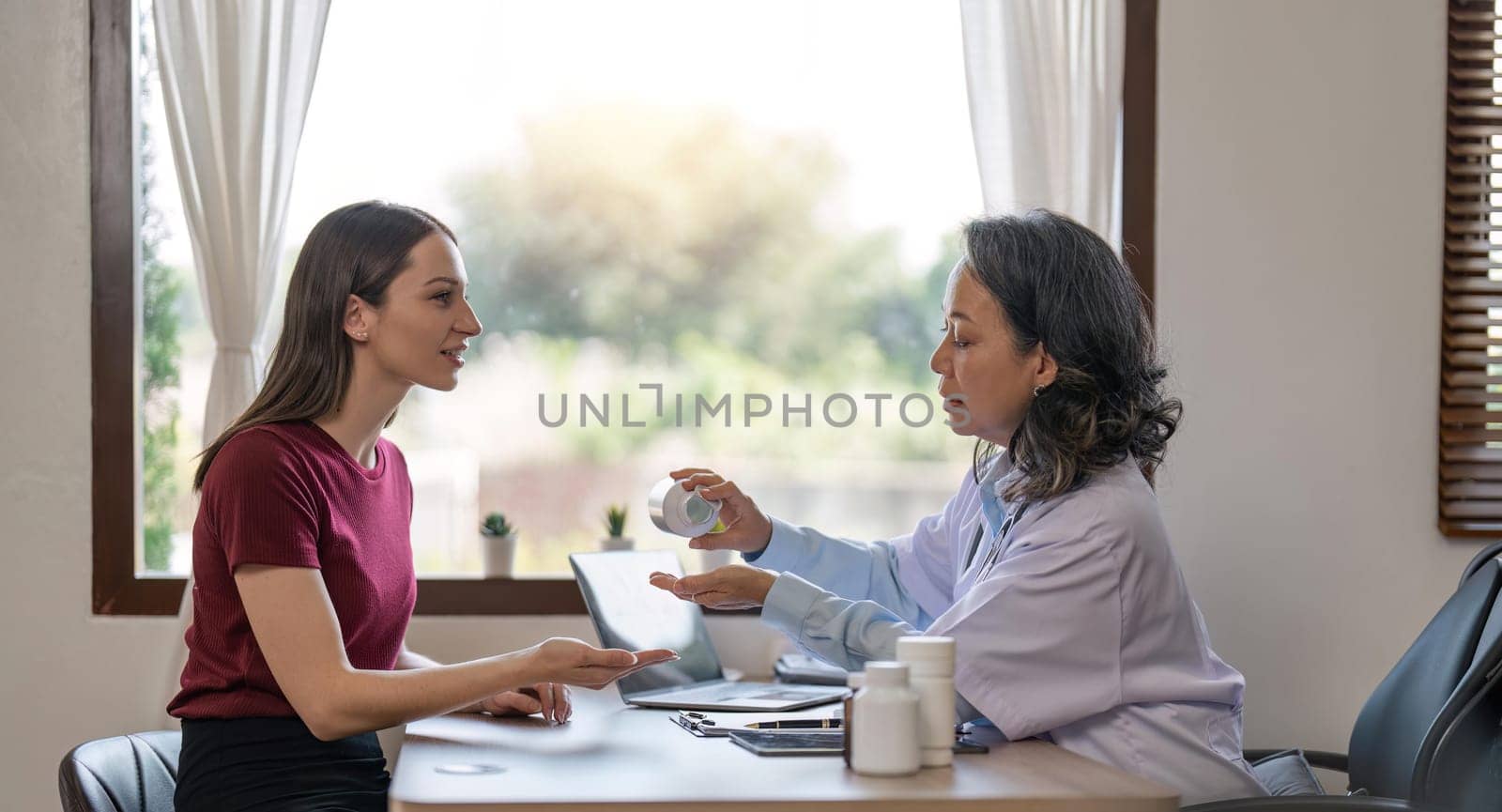 Consulting, doctor with woman in office for medical, checklist and results. Interview, healthcare and medicine with patient and expert in hospital for exam, help or advice.