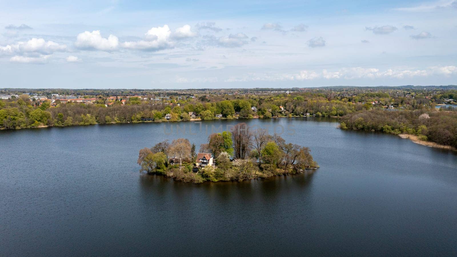 Farum, Denmark - May 04, 2022: Aerial drone view of Farum Lake and the island Klaus Nars Holm.