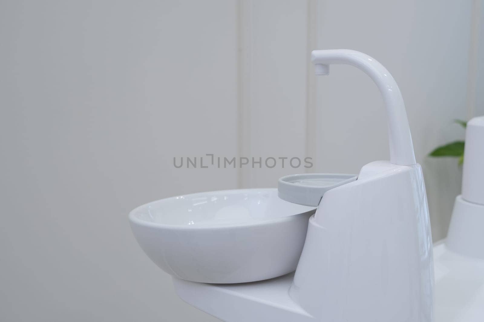 Dental cuspidor used for patients when they have to rinse their mouth. Dental cuspidor. Ceramic bowl