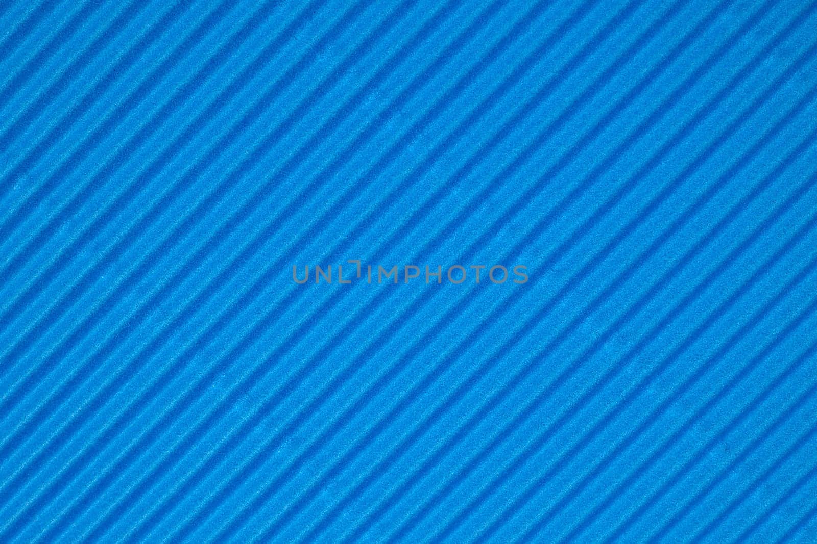 Blue diagonally ribbed cardboard. Meant as background