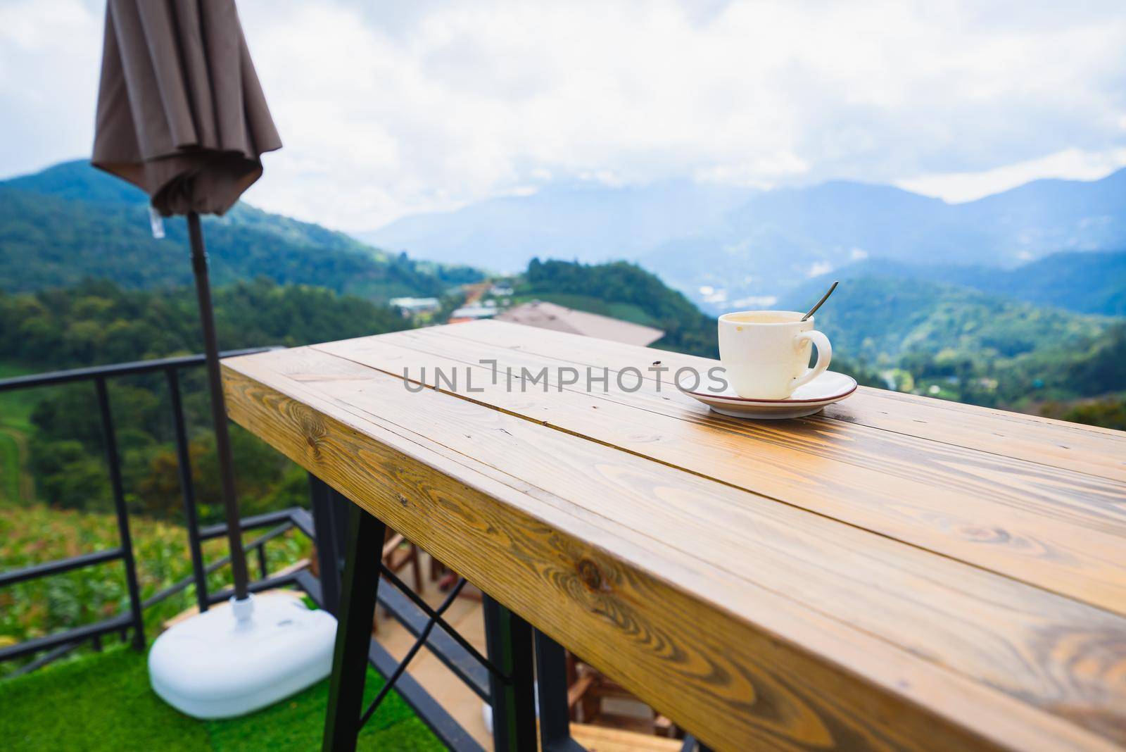 coffee on wood table at mountain view by Wmpix