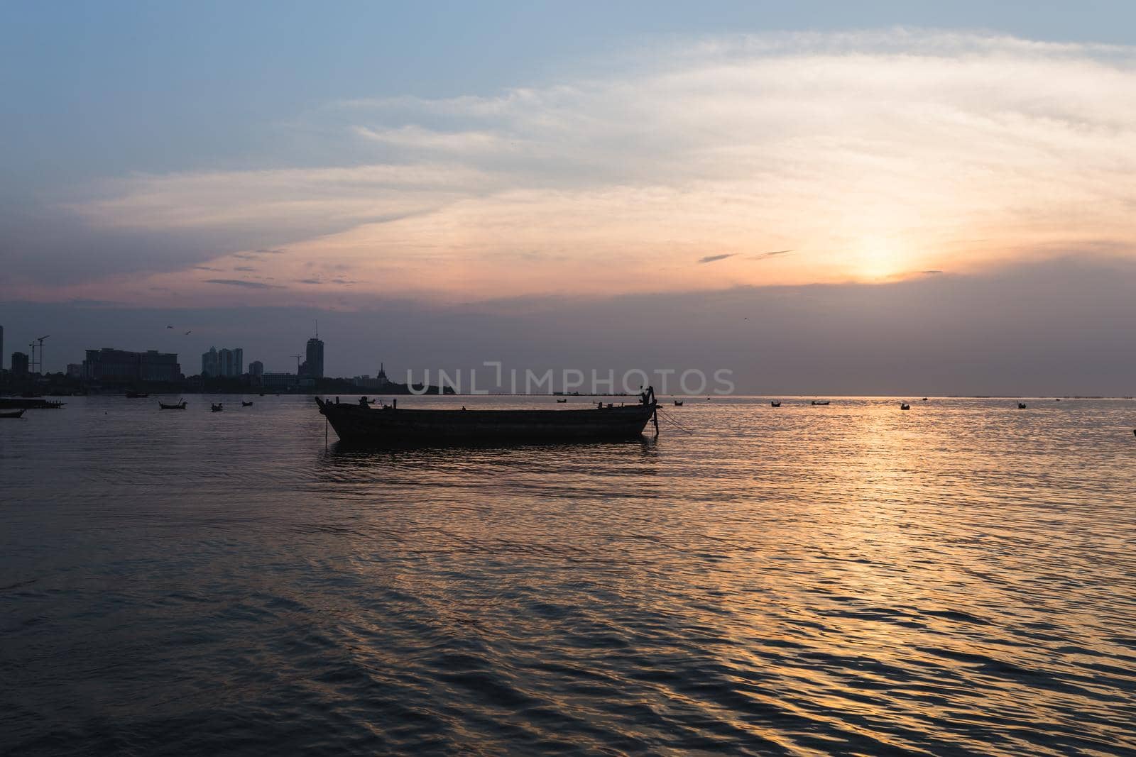 silhouette old boat sea sunset