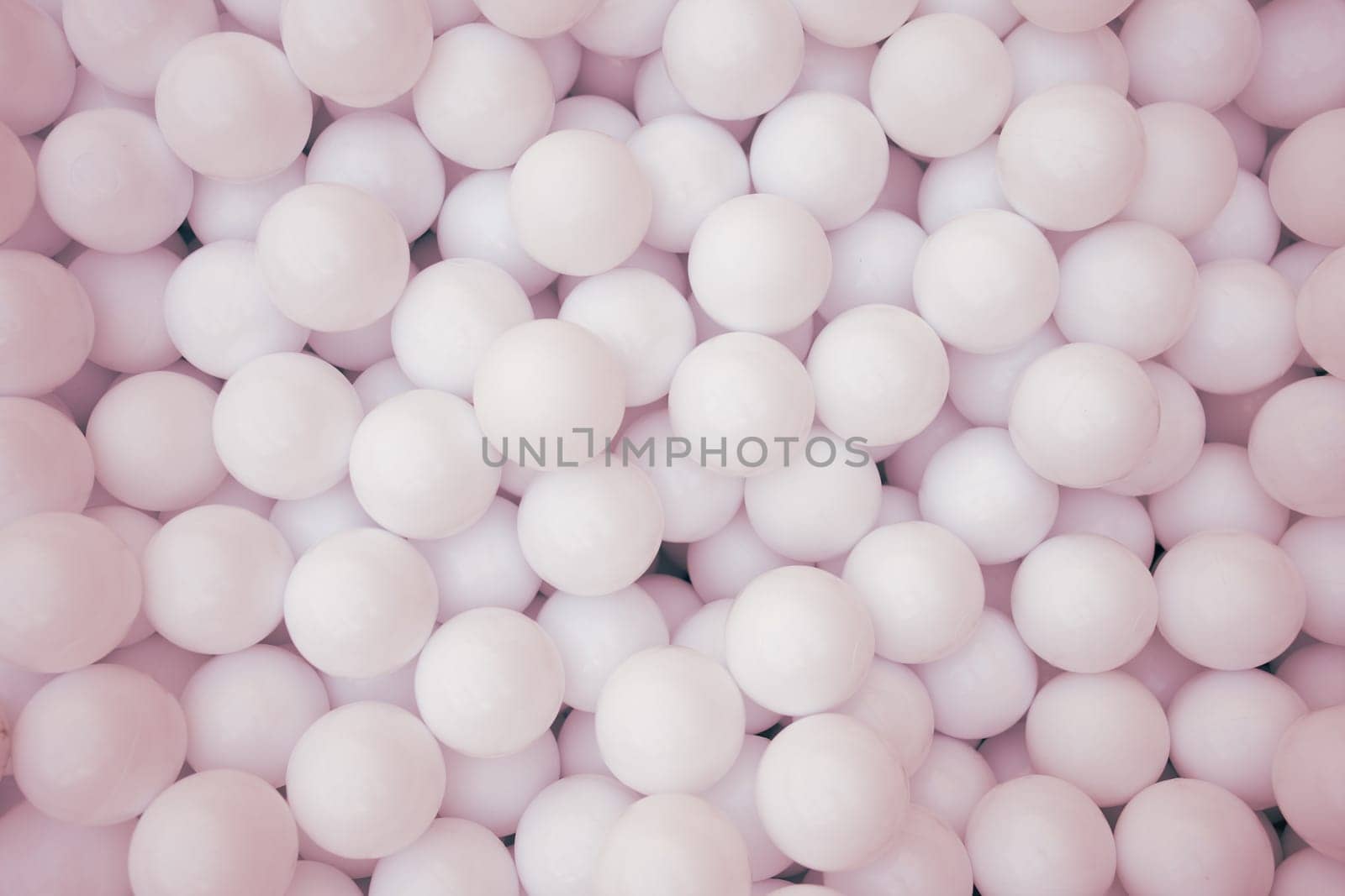 Many pink plastic balls for dry pool in amusement park