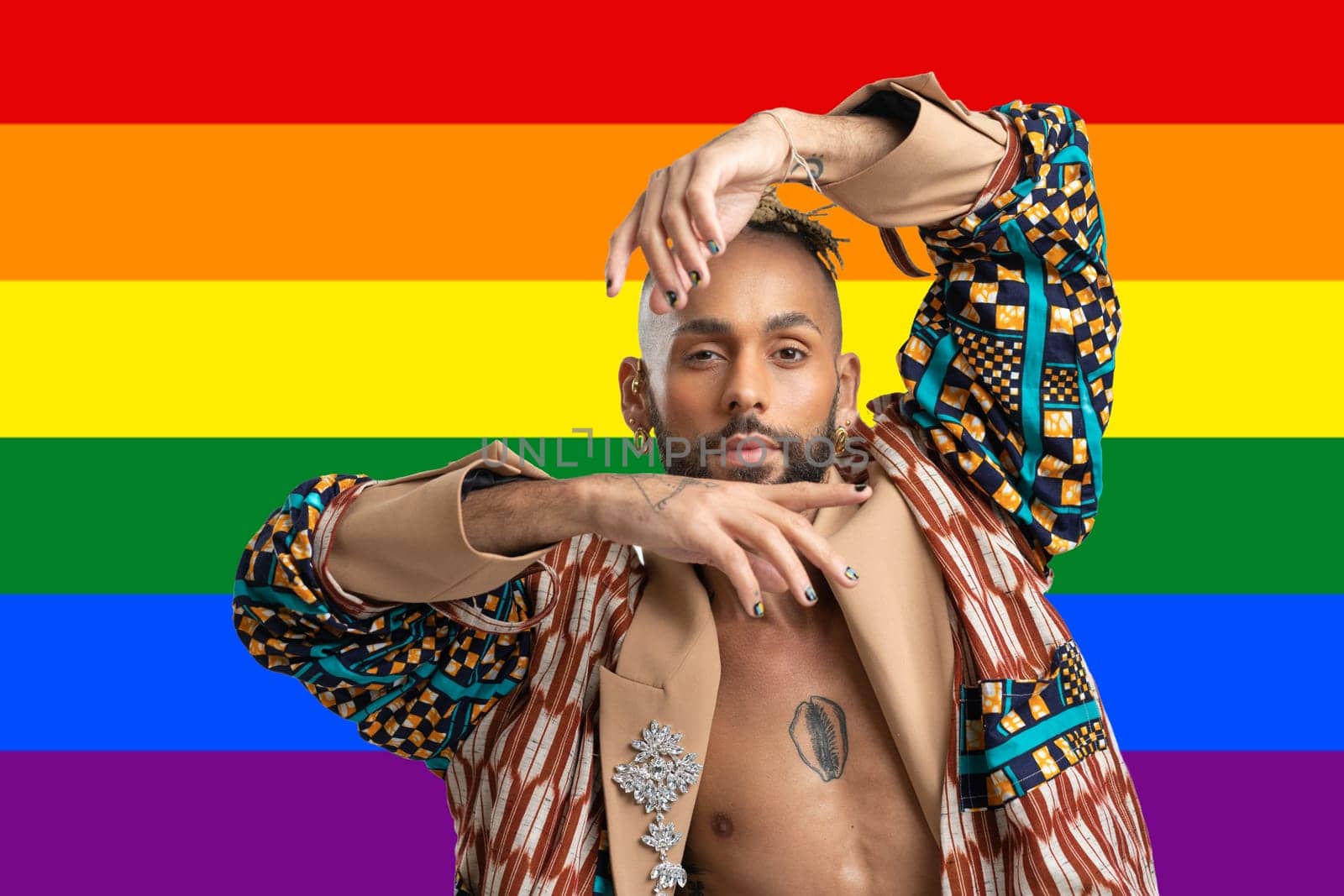 Portrait Trendy black latin gay man in fashionable clothes dancing isolated LGBT flag rainbow colors background studio portrait People fashion lgbtq concept.