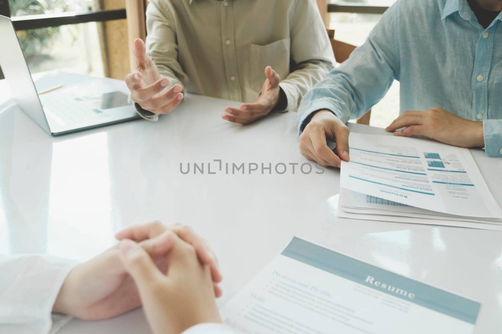 A Human Resource (HR) manager engages in an interview with a candidate, assessing their qualifications, skills, and suitability for the position. Through a comprehensive evaluation, the HR manager evaluates the candidate potential fit within the organization, ensuring a thorough selection process for the desired role.