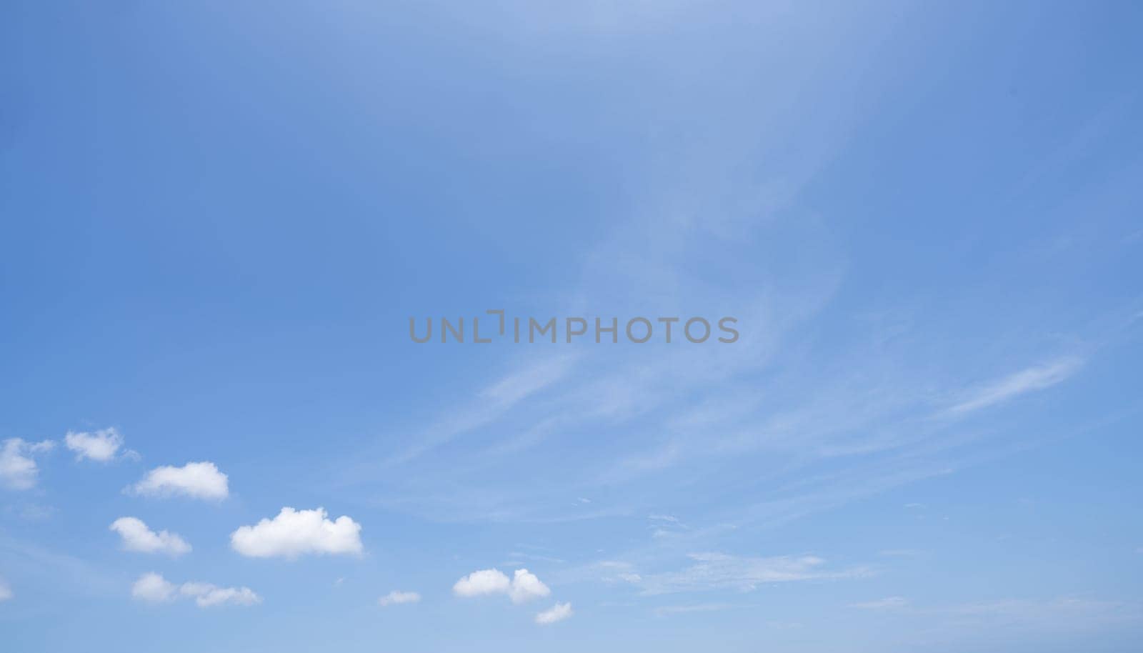 Beautiful blue sky and white cumulus clouds abstract background. Cloudscape background. Blue sky and fluffy white clouds on sunny days. Beautiful blue sky. World Ozone Day. Ozone layer. Summer sky.