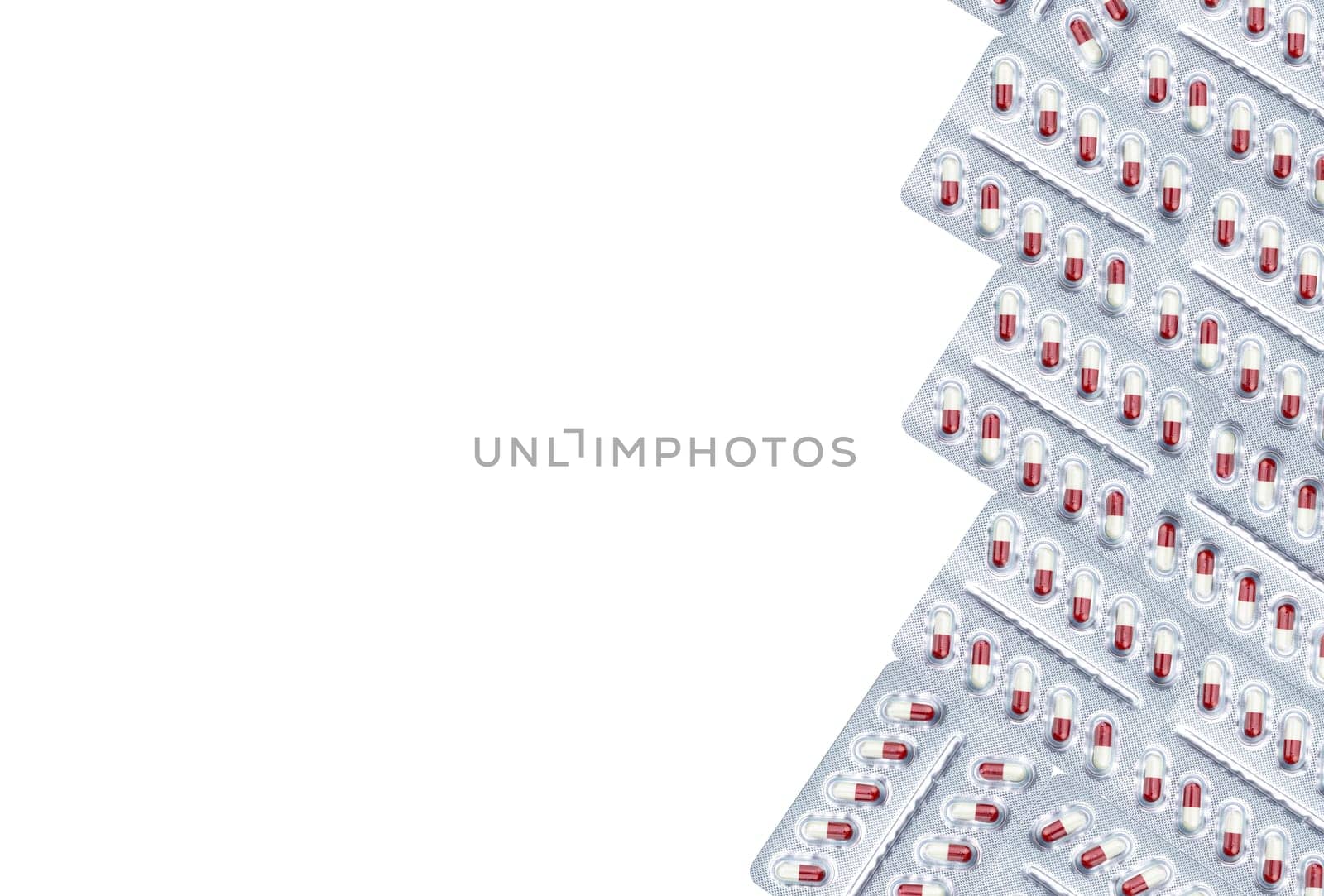White-red capsule pill in blister pack isolated on white background. Prescription drug. Pharmaceutical industry. Pregabalin for nerve pain and anticonvulsant. Neuropathic drug. Pharmaceutical drug. by Fahroni