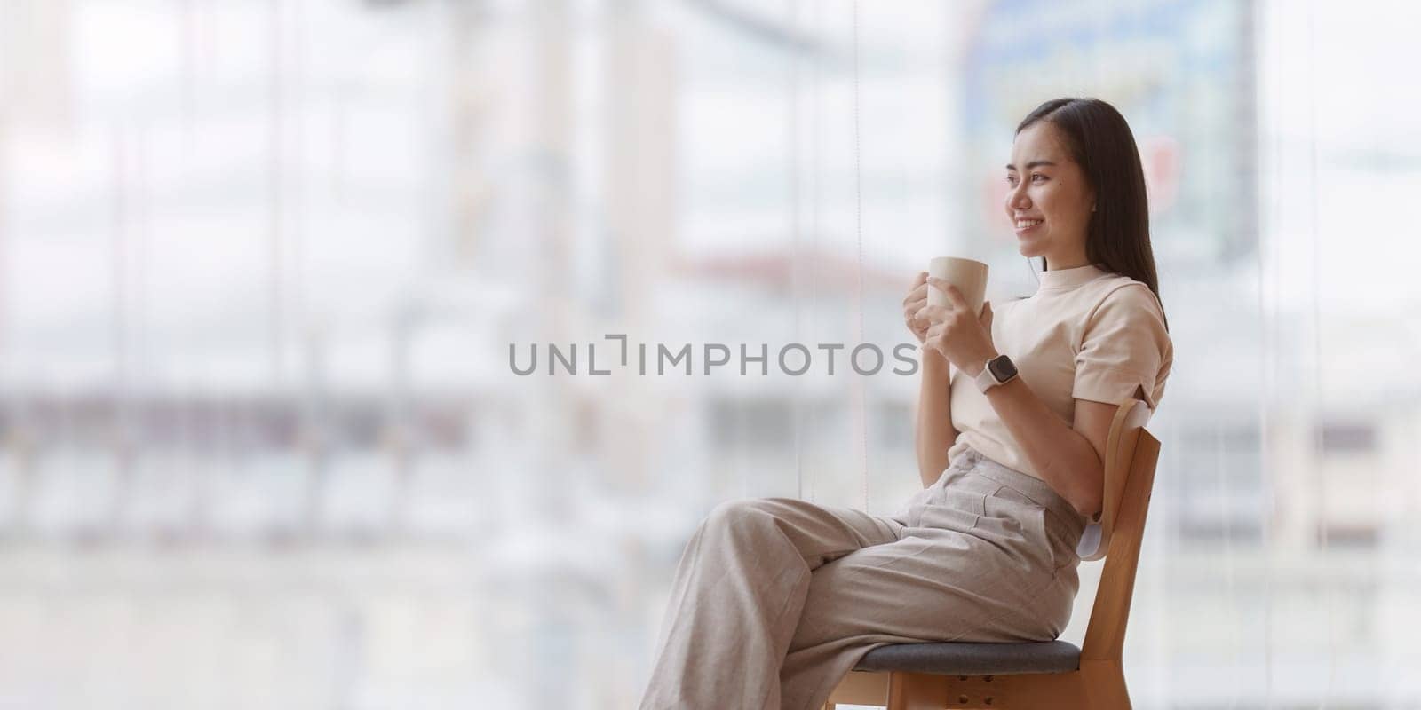 Businesswoman in office relaxing in chair. Resting with thoughtful mind thinking of life quality.