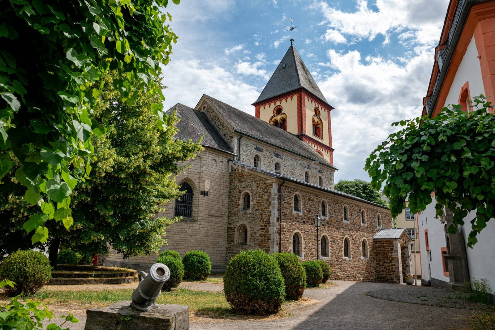 the church and a cannon in the town of erpel in germany by compuinfoto
