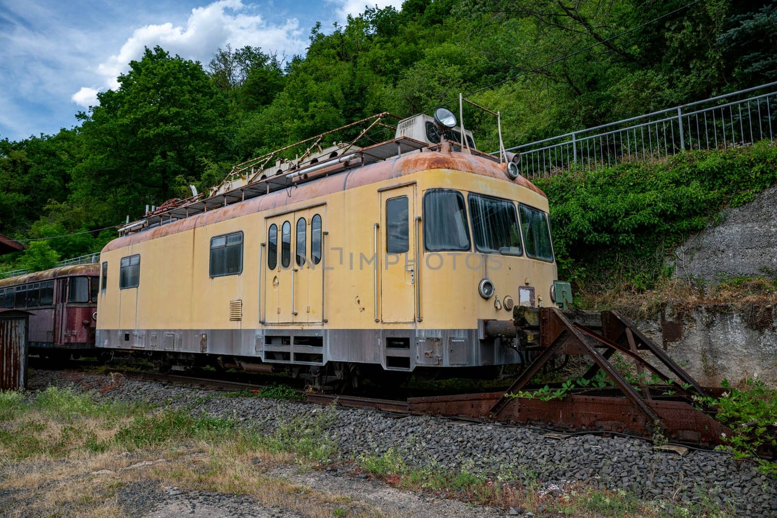 old yellow train in station Linz am rijn in germany by compuinfoto