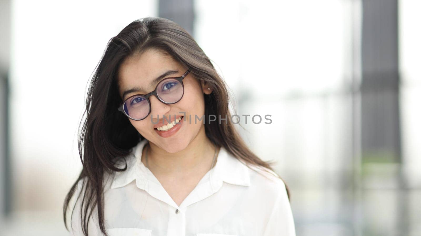 head shot portrait of a preppy, young, beautiful, confident and attractive woman