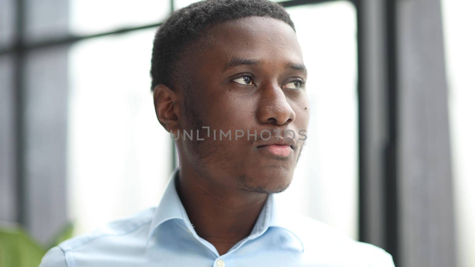 Portrait of an african american businessman in a blue shirt