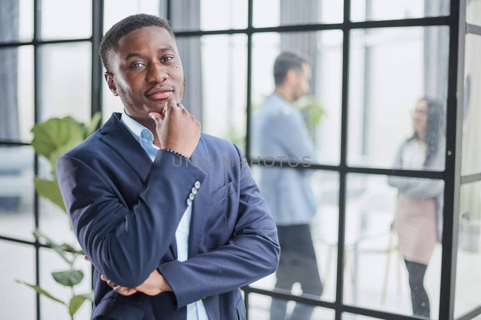 Pensive mixed race confident international company employee manager thinking of problem solution at office.