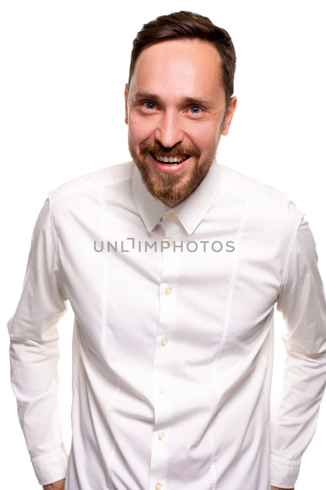 Stylish bearded business man smiling to camera, having pleased expression and cheerful look. Positive emotions concept.