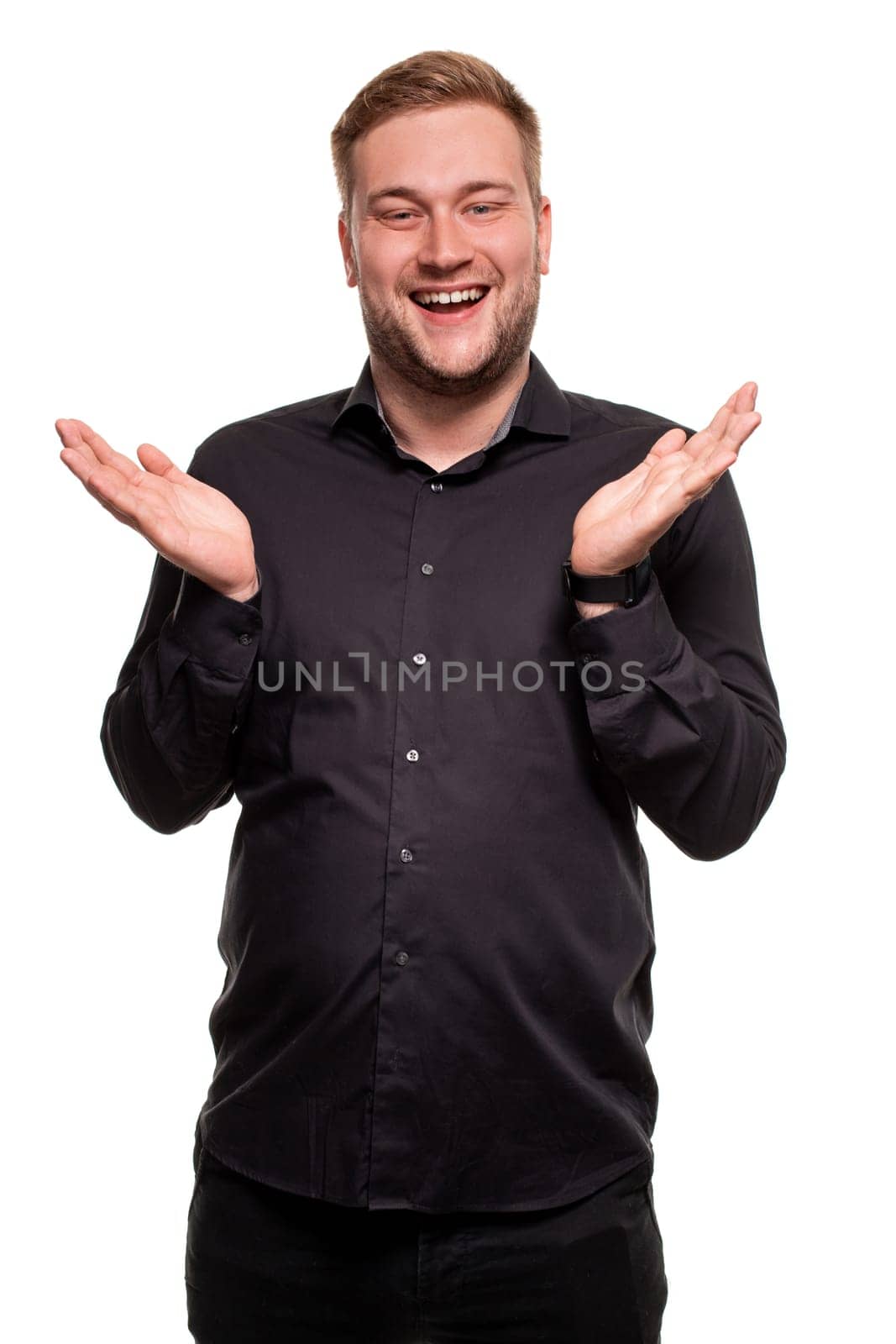 Bearded man smiling and spreading hands don't know what to say in answer. Body language. Emotional portrait on a white background