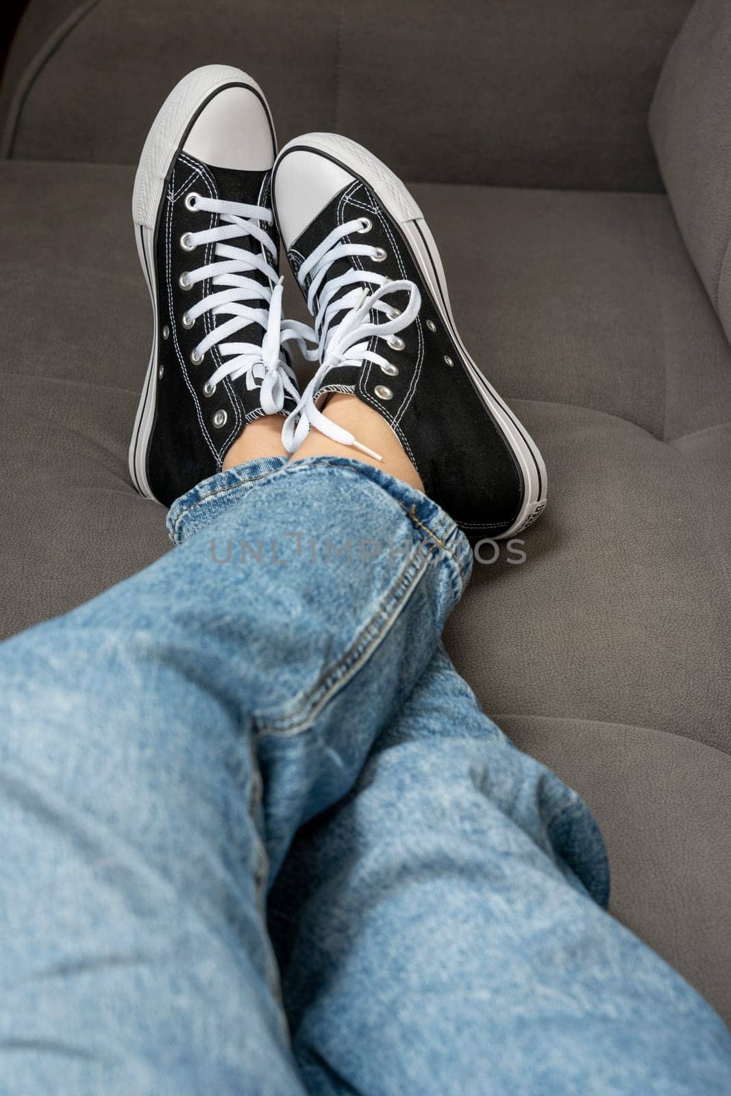 legs of a teenage girl dressed in blue jeans and new youth sneakers by audiznam2609