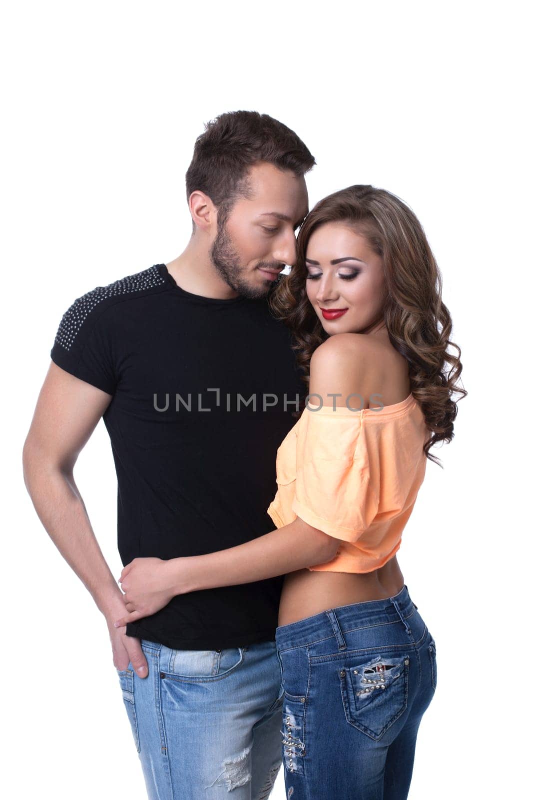 Smiling athletic models posing in casual clothes, isolated on white