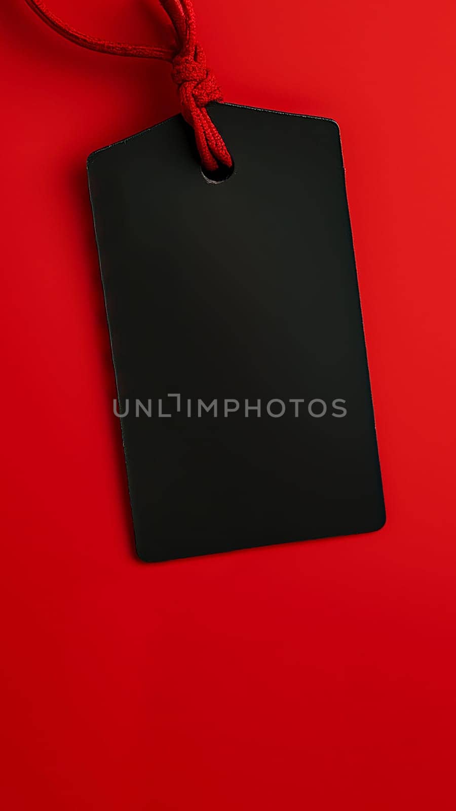 Black empty price tag on red background. Black Friday concept, template copyspace by ijeab